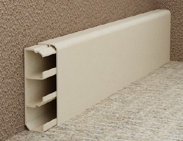 A beige carpet with a white shelf on it, enhanced by aluminium skirting.