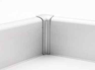 A close up image of a white tray with a corner, featuring aluminium skirting.