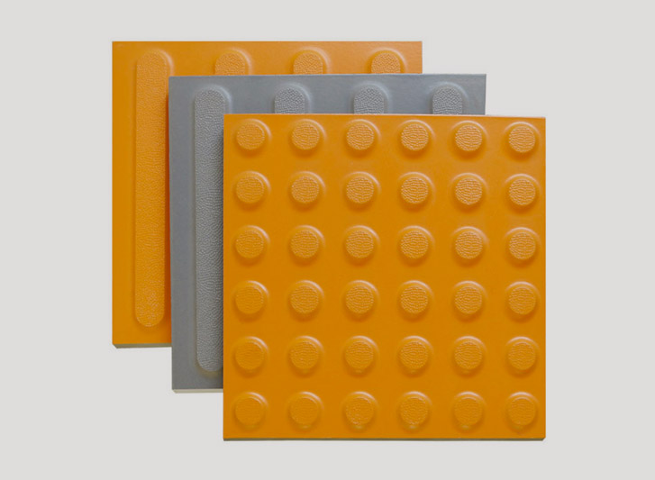 A set of three tactile tiles on a white background.