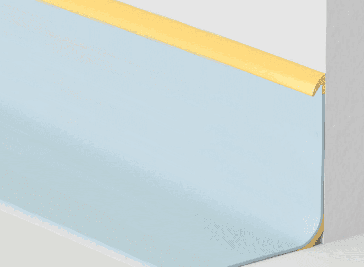 A blue and yellow corner of a wall with aluminium skirting.